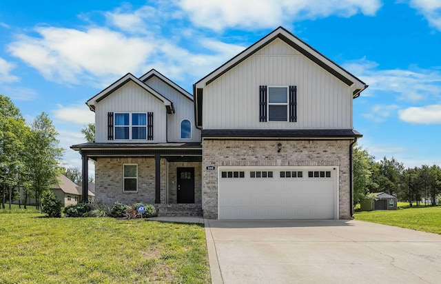 800 Snapdragon Ct, Clarksville, TN 37042 - view of front of house with concrete driveway, a front yard, brick siding, a garage, and covered porch
