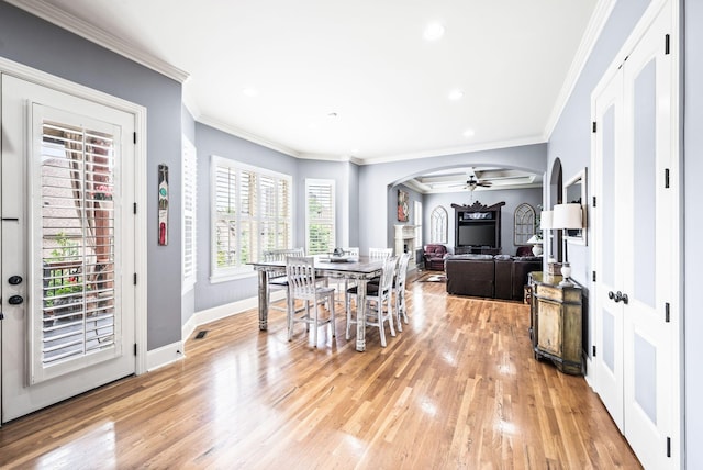 3009 Burnley Ct, Spring Hill, TN 37174 - dining space featuring light wood-style floors, arched walkways, baseboards, recessed lighting, and crown molding