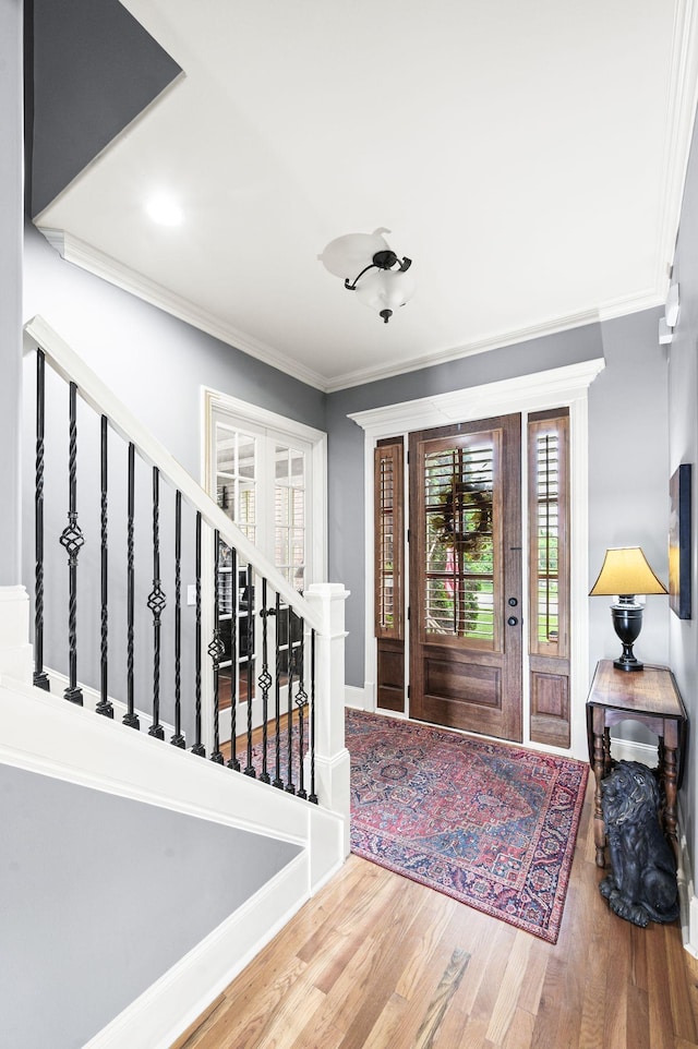 3009 Burnley Ct, Spring Hill, TN 37174 - foyer entrance with wood finished floors, ornamental molding, and stairs