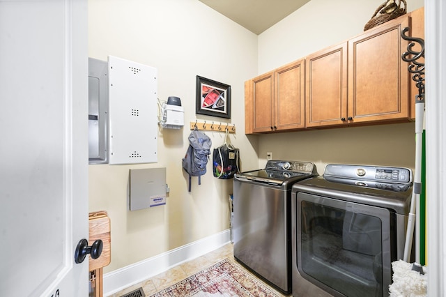 3009 Burnley Ct, Spring Hill, TN 37174 - washroom featuring separate washer and dryer, cabinet space, baseboards, light tile patterned floors, and electric panel