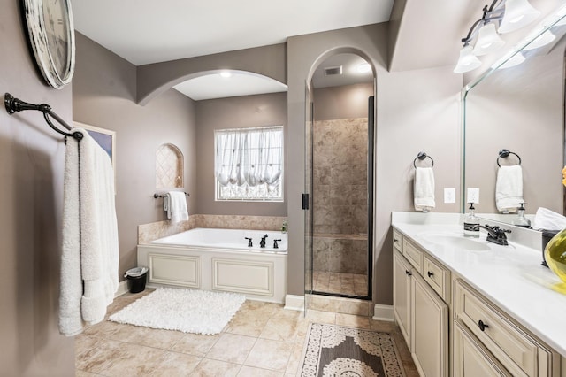 3009 Burnley Ct, Spring Hill, TN 37174 - full bathroom featuring a shower stall, a garden tub, vanity, and tile patterned floors