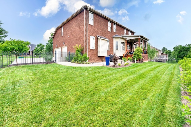 3009 Burnley Ct, Spring Hill, TN 37174 - back of house with an attached garage, brick siding, and concrete driveway