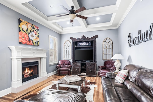3009 Burnley Ct, Spring Hill, TN 37174 - living room featuring a ceiling fan, coffered ceiling, a warm lit fireplace, crown molding, and light wood finished floors