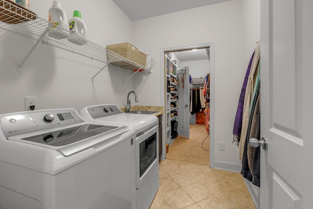 1144 Frewin St, Nolensville, TN 37135 - laundry room with washer and dryer, light tile patterned flooring, and baseboards
