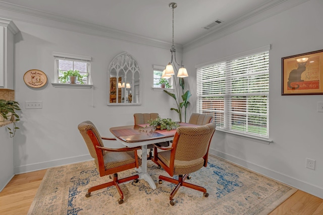 1144 Frewin St, Nolensville, TN 37135 - dining space with crown molding, baseboards, and light wood-style floors