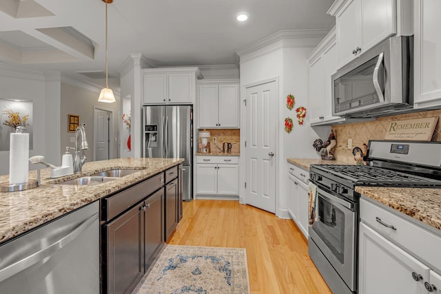1144 Frewin St, Nolensville, TN 37135 - kitchen with appliances with stainless steel finishes, a sink, white cabinets, crown molding, and recessed lighting