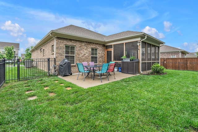 1144 Frewin St, Nolensville, TN 37135 - rear view of house with a sunroom, a patio, a shingled roof, and brick siding