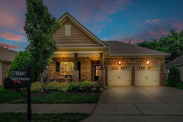 1144 Frewin St, Nolensville, TN 37135 - craftsman-style home featuring concrete driveway, a garage, covered porch, and brick siding