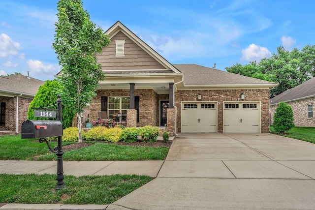 1144 Frewin St, Nolensville, TN 37135 - craftsman-style house with concrete driveway, a garage, brick siding, covered porch, and a shingled roof