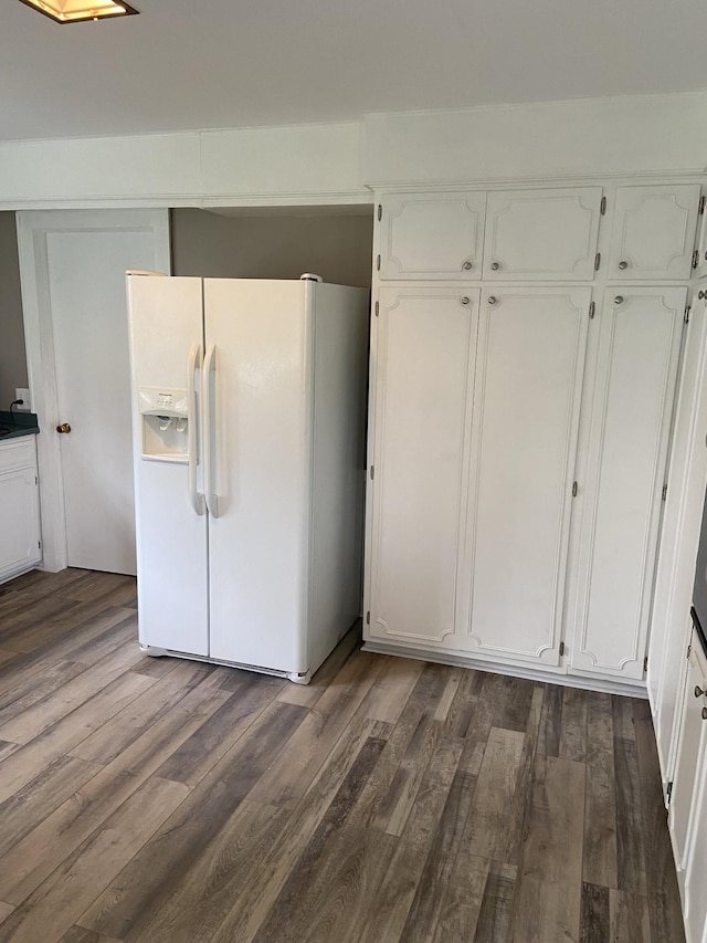 11495 Guthrie Rd, Guthrie, KY 42234 - kitchen with white fridge with ice dispenser, dark wood-style floors, and white cabinetry