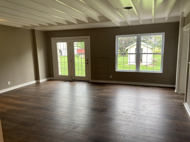 11495 Guthrie Rd, Guthrie, KY 42234 - spare room featuring dark wood-style flooring, beamed ceiling, and baseboards