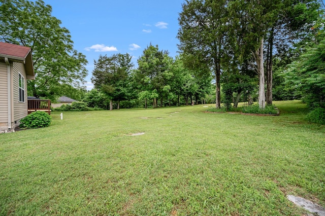 2480 Mount Lebanon Rd, Lewisburg, TN 37091 - view of green lawn with view of scattered trees and a wooden deck