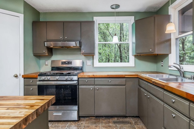 192 Askin Ln, Baxter, TN 38544 - kitchen featuring wood counters, stainless steel range with gas stovetop, under cabinet range hood, and gray cabinets