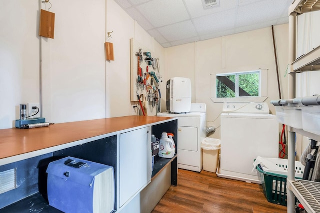 192 Askin Ln, Baxter, TN 38544 - laundry room with separate washer and dryer, wood finished floors, and cabinet space