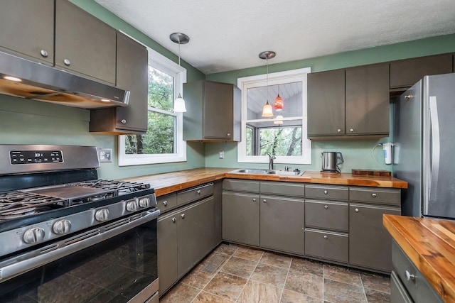 192 Askin Ln, Baxter, TN 38544 - kitchen featuring butcher block counters, appliances with stainless steel finishes, a sink, under cabinet range hood, and gray cabinets