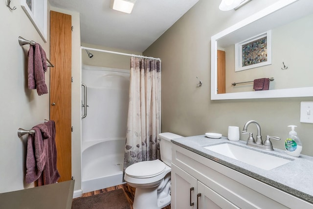 192 Askin Ln, Baxter, TN 38544 - full bathroom with vanity, a shower with shower curtain, toilet, and wood finished floors