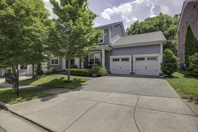 410 Dabney Dr, Franklin, TN 37064 - view of front of home featuring an attached garage, driveway, and a front lawn
