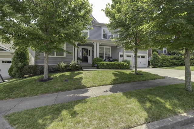 410 Dabney Dr, Franklin, TN 37064 - obstructed view of property with driveway, a front lawn, and covered porch