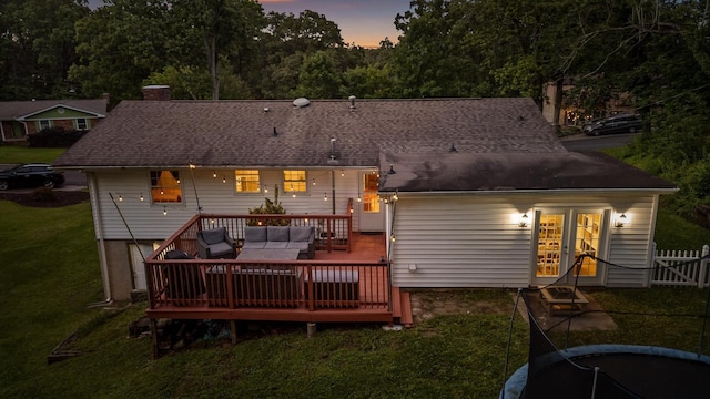 1310 Tabitha Dr, Hixson, TN 37343 - rear view of property with an outdoor hangout area, a wooden deck, a chimney, a lawn, and french doors