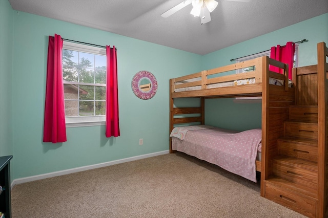 1310 Tabitha Dr, Hixson, TN 37343 - carpeted bedroom featuring baseboards and ceiling fan
