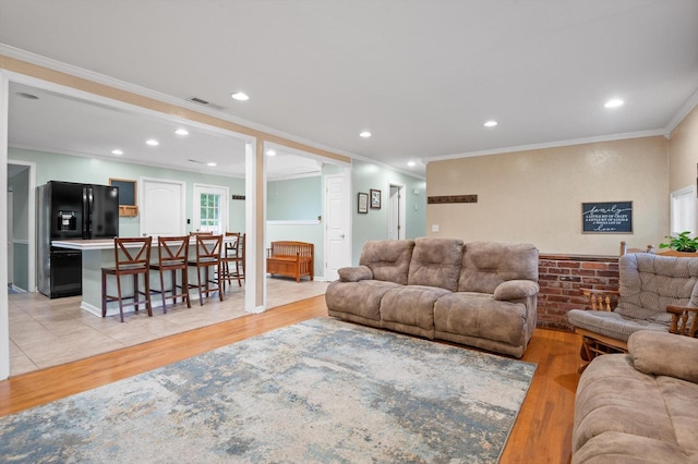 1310 Tabitha Dr, Hixson, TN 37343 - living area with light wood-type flooring, crown molding, and recessed lighting
