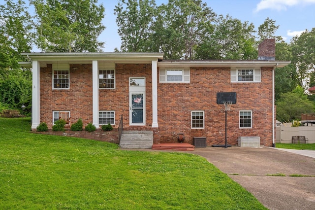 1310 Tabitha Dr, Hixson, TN 37343 - raised ranch featuring a chimney, brick siding, concrete driveway, and cooling unit