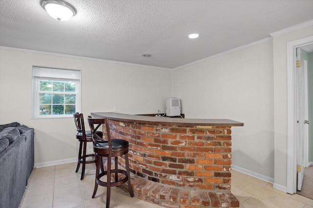 1310 Tabitha Dr, Hixson, TN 37343 - indoor wet bar with tile patterned flooring, crown molding, a textured ceiling, baseboards, and recessed lighting