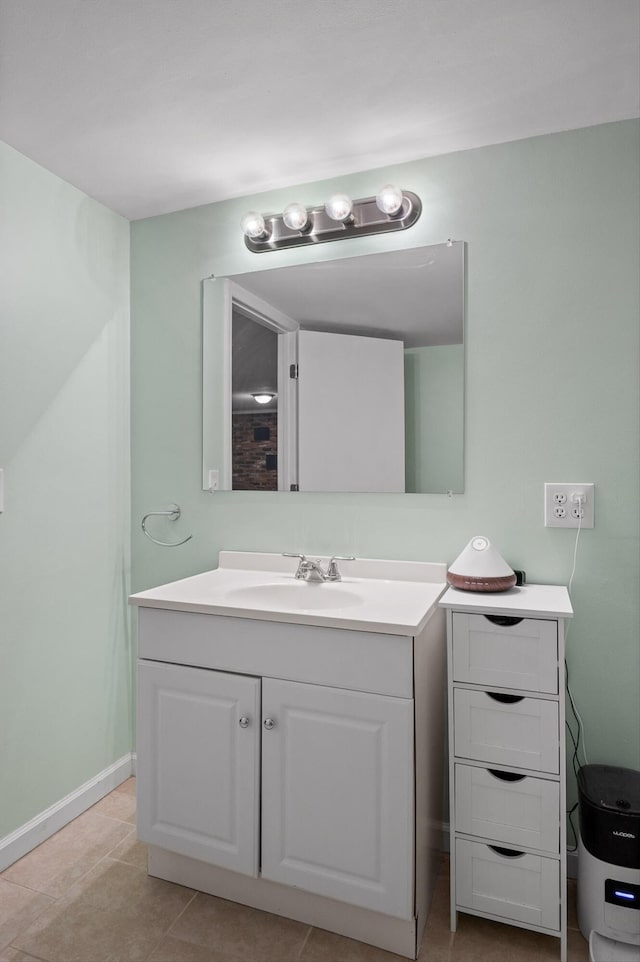 1310 Tabitha Dr, Hixson, TN 37343 - bathroom featuring vanity, baseboards, and tile patterned flooring