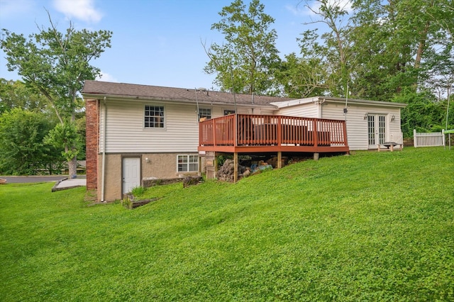 1310 Tabitha Dr, Hixson, TN 37343 - back of property with a wooden deck, a lawn, and french doors