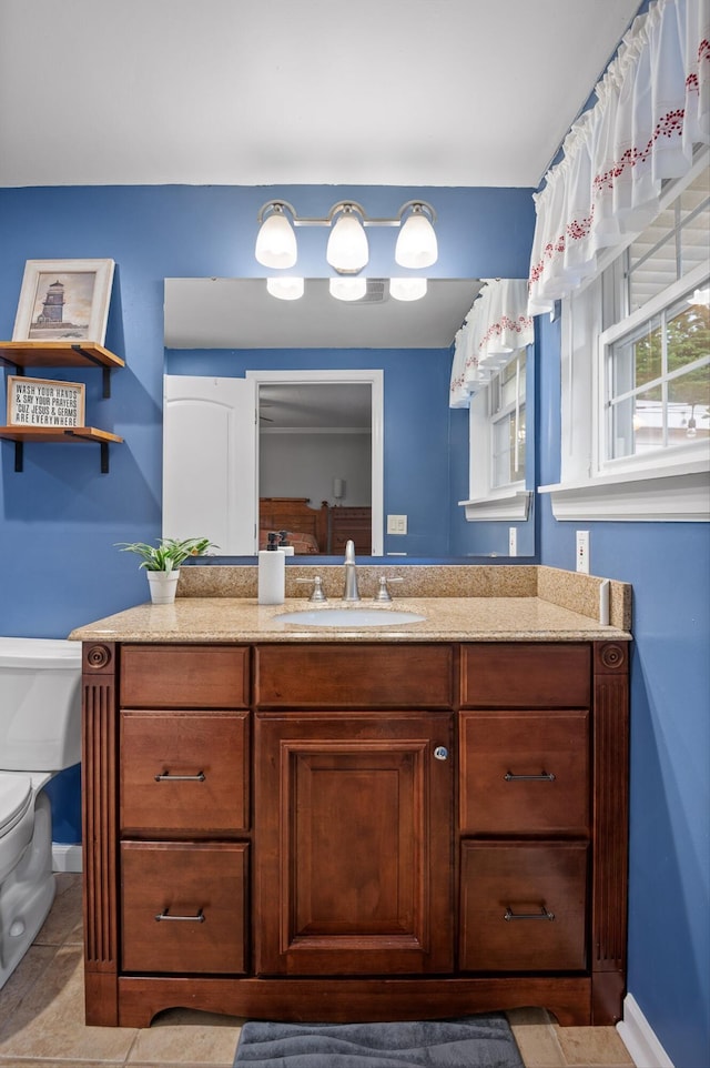 1310 Tabitha Dr, Hixson, TN 37343 - bathroom with toilet, vanity, and baseboards