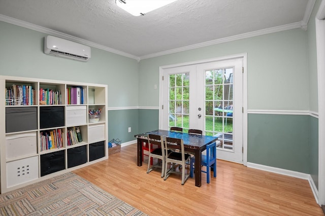 1310 Tabitha Dr, Hixson, TN 37343 - dining area with a wall unit AC, french doors, ornamental molding, wood finished floors, and baseboards