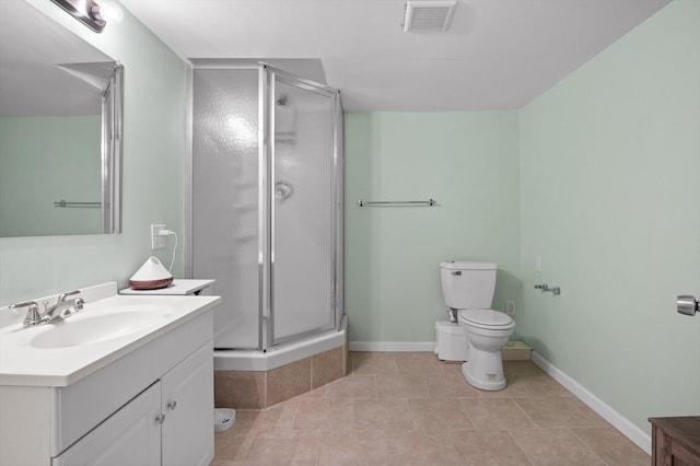 1310 Tabitha Dr, Hixson, TN 37343 - bathroom with vanity, toilet, a stall shower, and baseboards