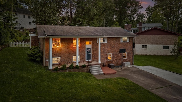 1310 Tabitha Dr, Hixson, TN 37343 - raised ranch with brick siding, a chimney, and a shingled roof