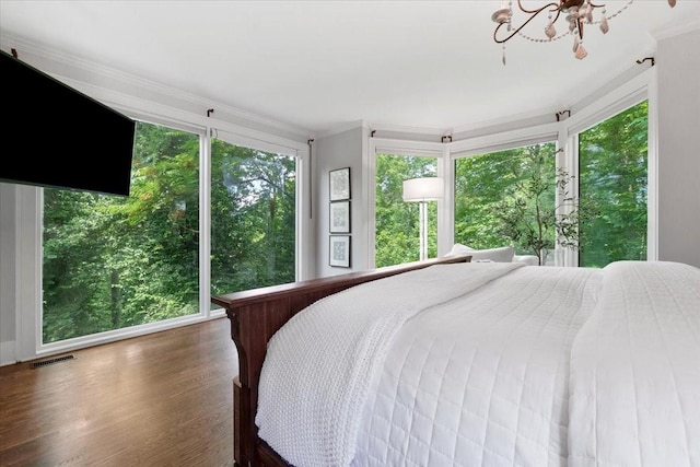 5400 Hillsboro Pike, Nashville, TN 37215 - bedroom with ornamental molding, wood finished floors, and a chandelier