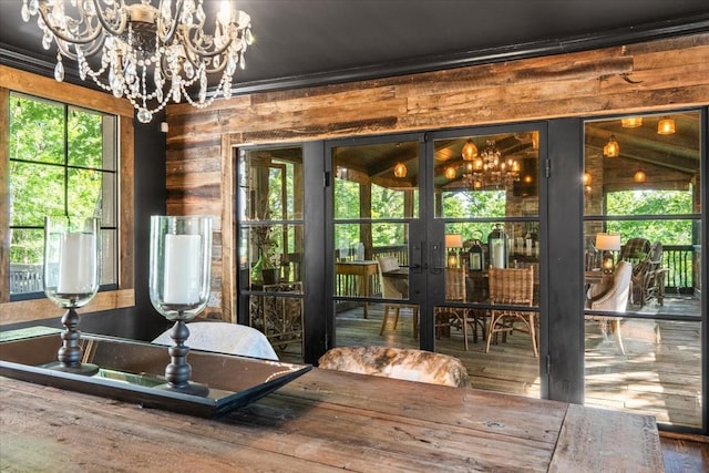 5400 Hillsboro Pike, Nashville, TN 37215 - doorway to outside with a chandelier, french doors, crown molding, wooden walls, and wood finished floors