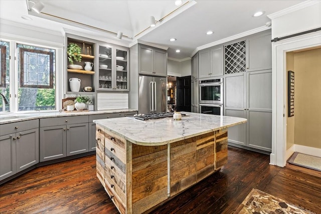 5400 Hillsboro Pike, Nashville, TN 37215 - kitchen with gray cabinetry, stainless steel appliances, crown molding, dark wood finished floors, and a kitchen island