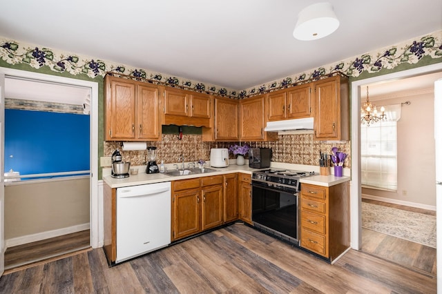 1113 Jacksons Valley Rd, Hermitage, TN 37076 - kitchen featuring dishwasher, gas range oven, under cabinet range hood, a sink, and light countertops