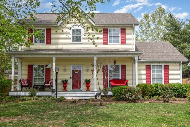 1113 Jacksons Valley Rd, Hermitage, TN 37076 - view of front facade with covered porch, a front lawn, and roof with shingles