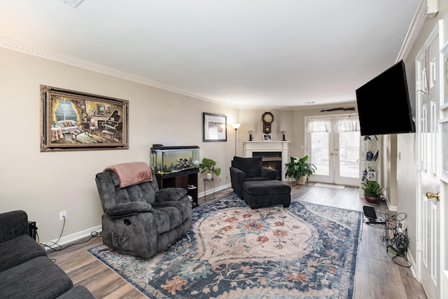 1113 Jacksons Valley Rd, Hermitage, TN 37076 - living area with wood finished floors, french doors, crown molding, baseboards, and a warm lit fireplace
