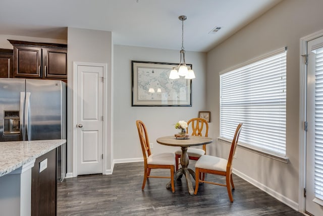 221 Kinsale Dr, Spring Hill, TN 37174 - dining area featuring dark wood finished floors and baseboards