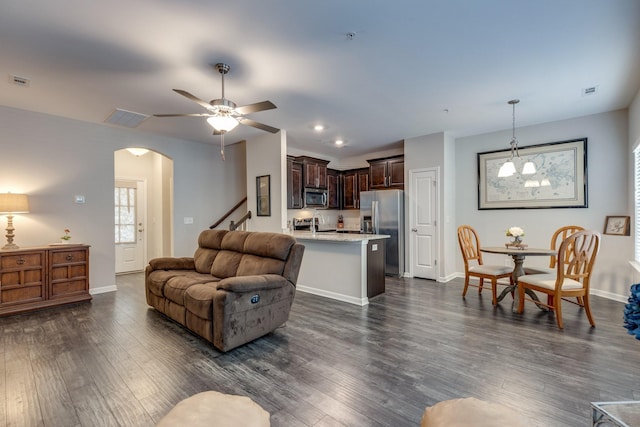 221 Kinsale Dr, Spring Hill, TN 37174 - living area with arched walkways, dark wood-style floors, ceiling fan, baseboards, and recessed lighting