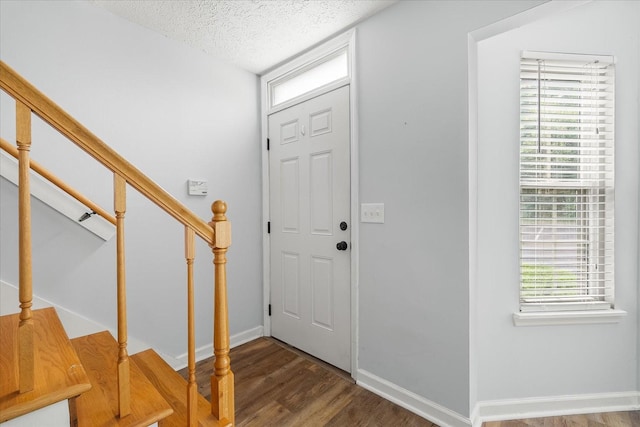 250 Sanders Ferry Rd Unit 65, Hendersonville, TN 37075 - foyer entrance featuring wood finished floors, a textured ceiling, baseboards, and stairway