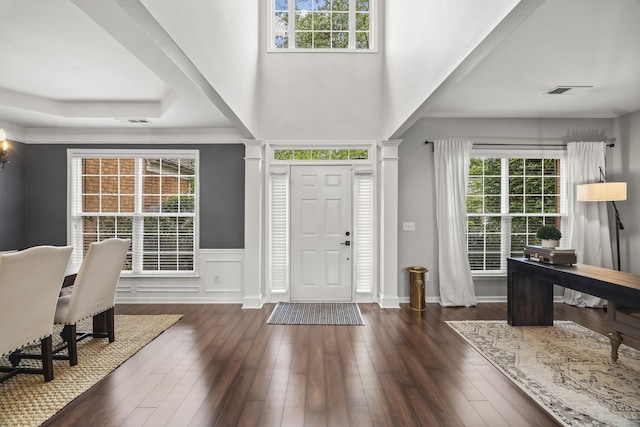 5517 Nevil Pt, Brentwood, TN 37027 - entrance foyer featuring healthy amount of natural light, wainscoting, dark wood-style flooring, a decorative wall, and a chandelier