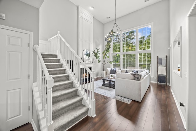 5517 Nevil Pt, Brentwood, TN 37027 - living area with stairway, dark wood-style flooring, baseboards, and a high ceiling