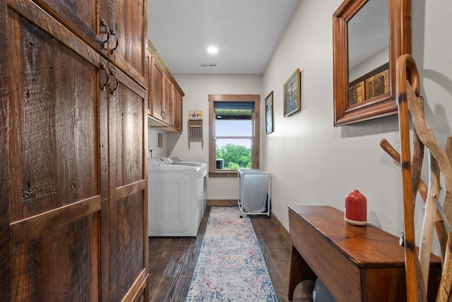 4499 Benson Rd, Springfield, TN 37172 - laundry area with washer and dryer, cabinet space, dark wood-style flooring, and baseboards