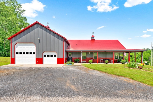 4499 Benson Rd, Springfield, TN 37172 - view of front of home with a front lawn, a porch, gravel driveway, metal roof, and board and batten siding
