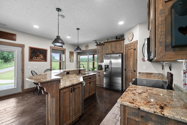 4499 Benson Rd, Springfield, TN 37172 - kitchen with stainless steel appliances, a sink, a kitchen island with sink, dark wood finished floors, and recessed lighting