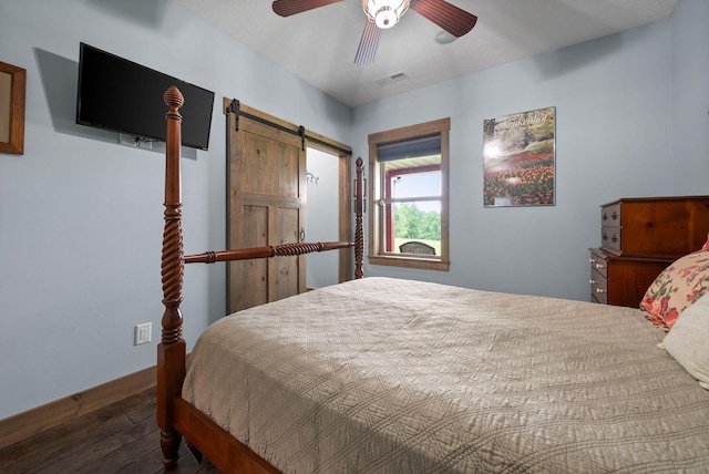 4499 Benson Rd, Springfield, TN 37172 - bedroom featuring a barn door, wood finished floors, and a ceiling fan