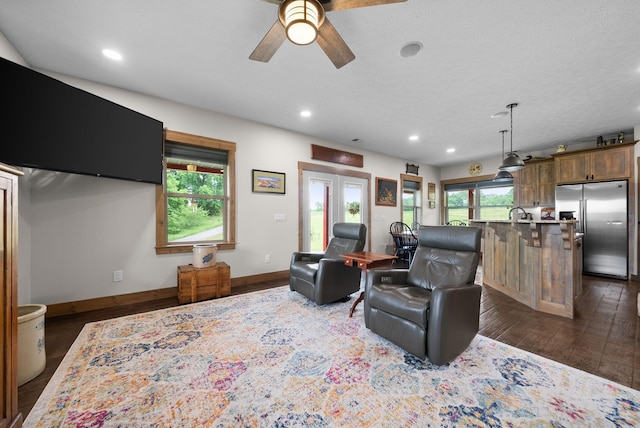 4499 Benson Rd, Springfield, TN 37172 - living area with recessed lighting, a ceiling fan, dark wood-style floors, and baseboards