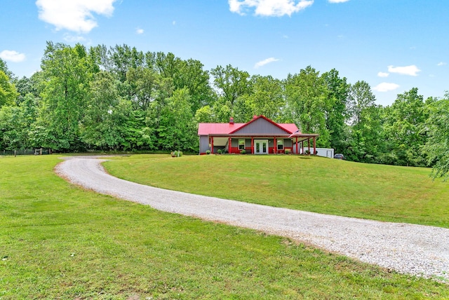4499 Benson Rd, Springfield, TN 37172 - view of green lawn featuring gravel driveway and a forest view